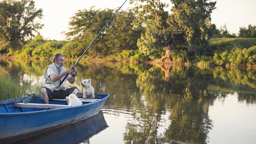 Man and his dog fishing