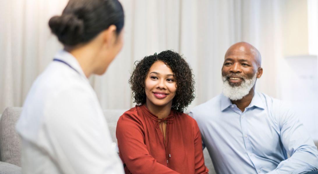 Husband and wife meeting with doctor