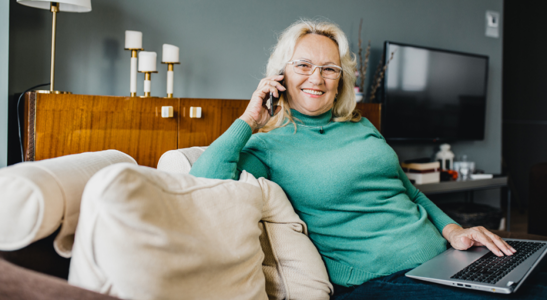 Woman sitting on the couch talking on the phone