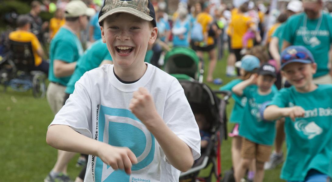 Child laughing and dancing at the Moving Day walk in Minneapolis