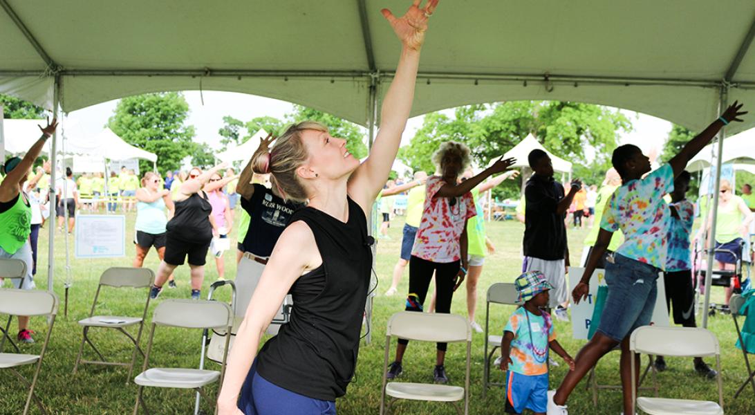 Woman stretching during the Moving Day walk for Parkinson's