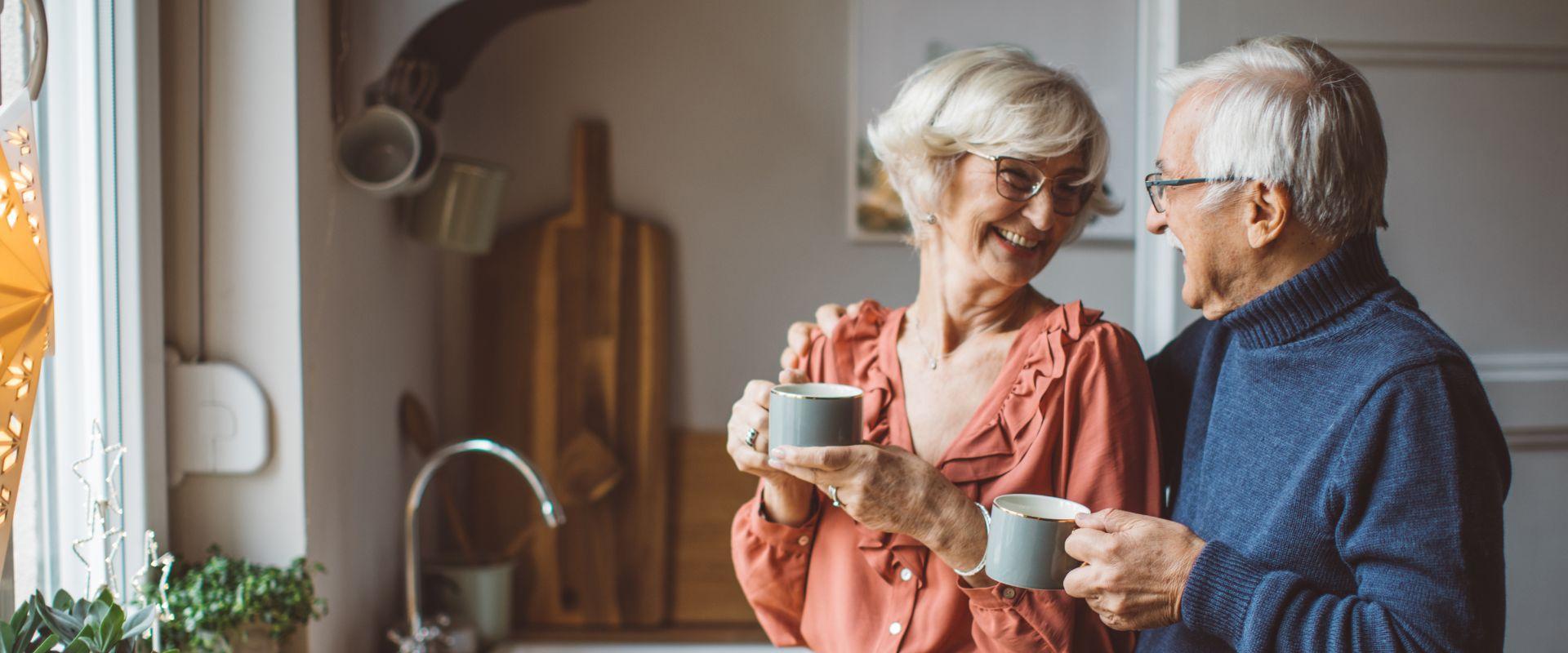 Couple drinking coffee together in the kitchen