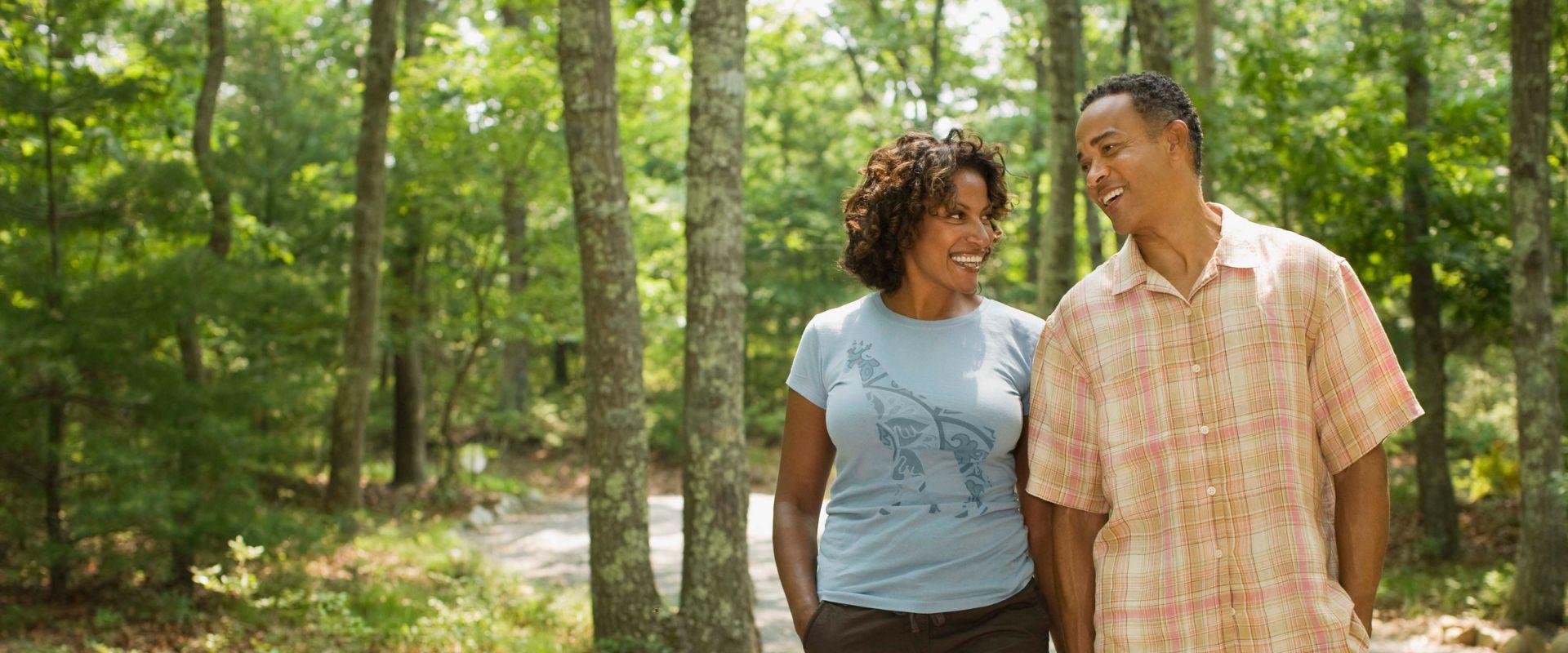 Couple walking through the woods