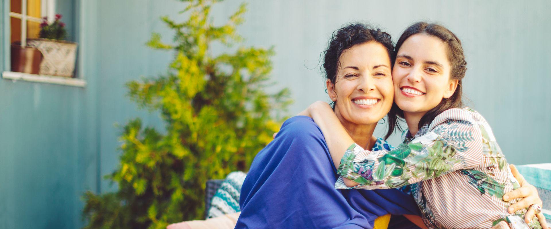 Mother and daughter hugging