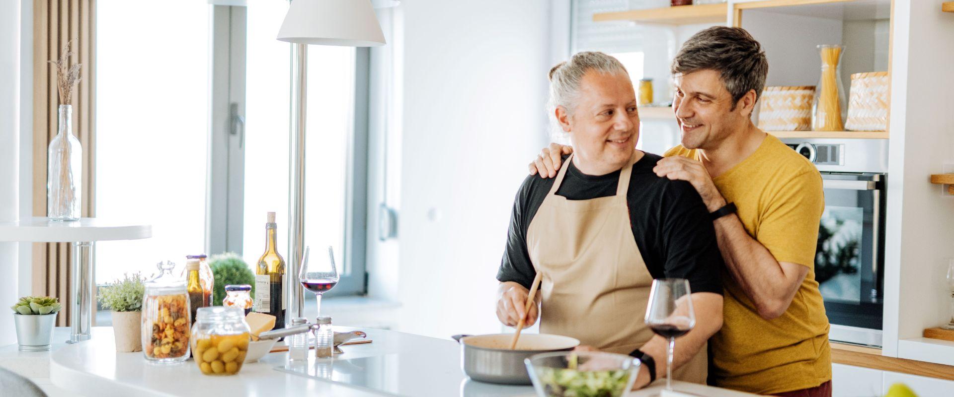 Two men cooking together in the kitchen