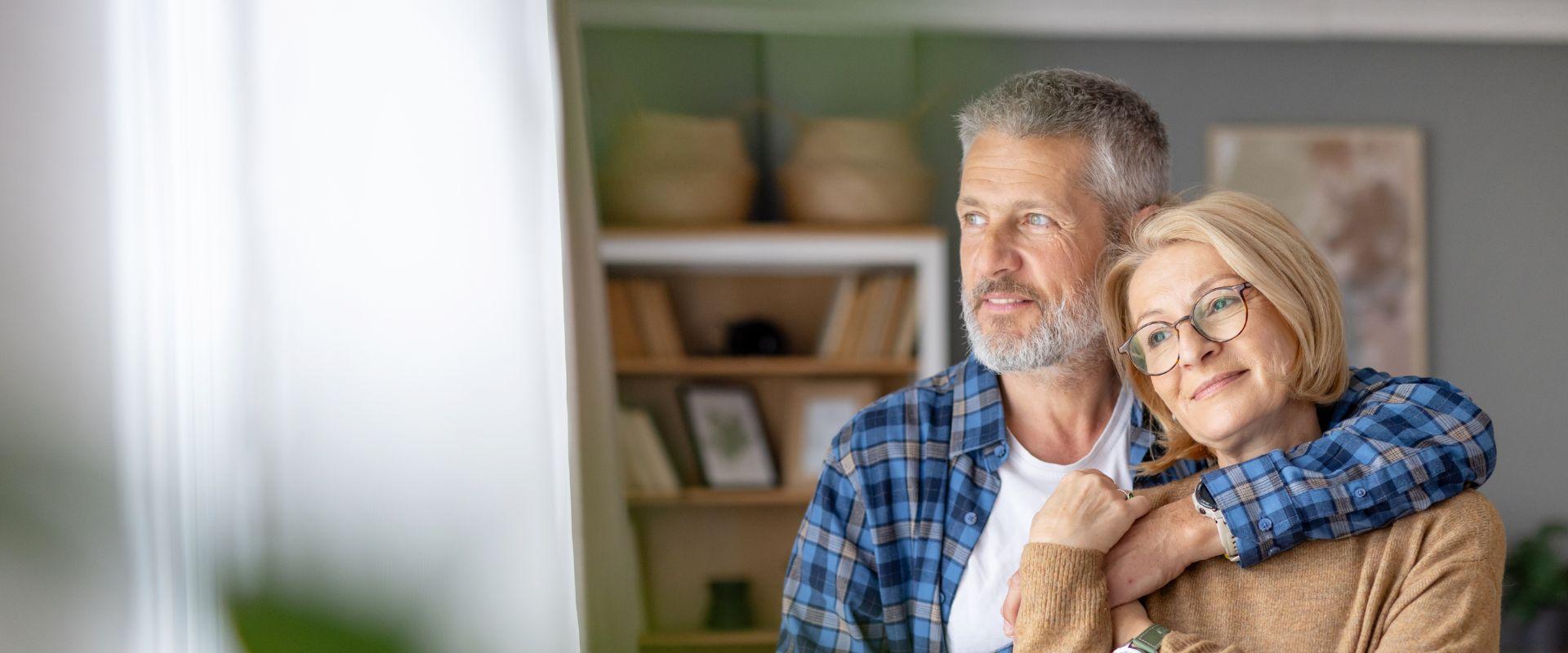 Man putting arm around his wife