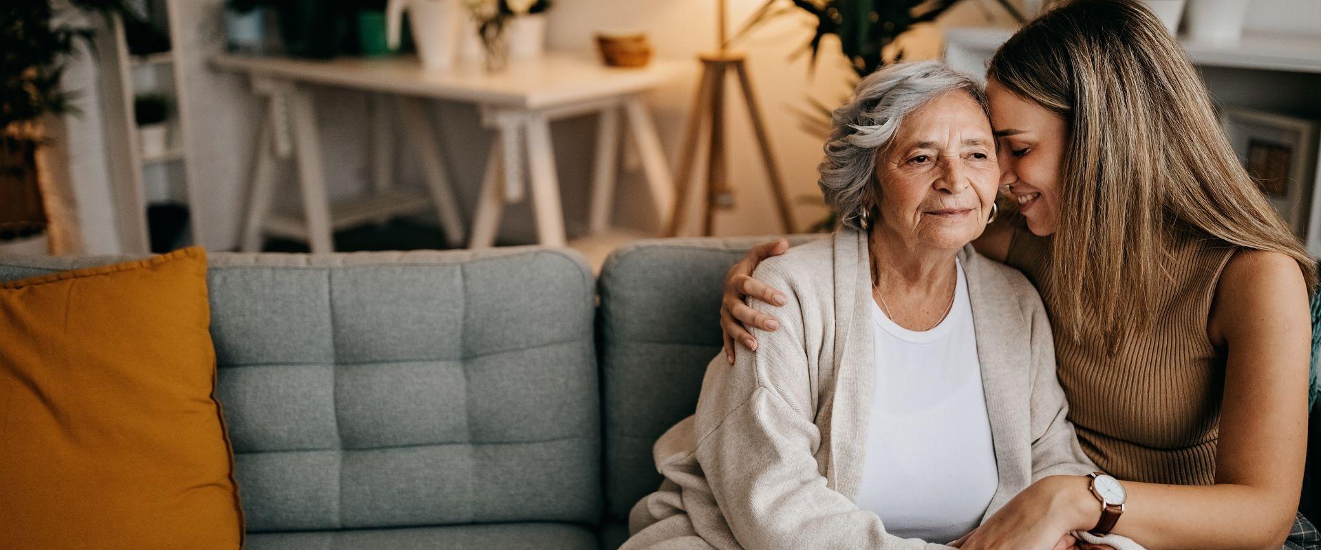 Woman embracing her senior mother