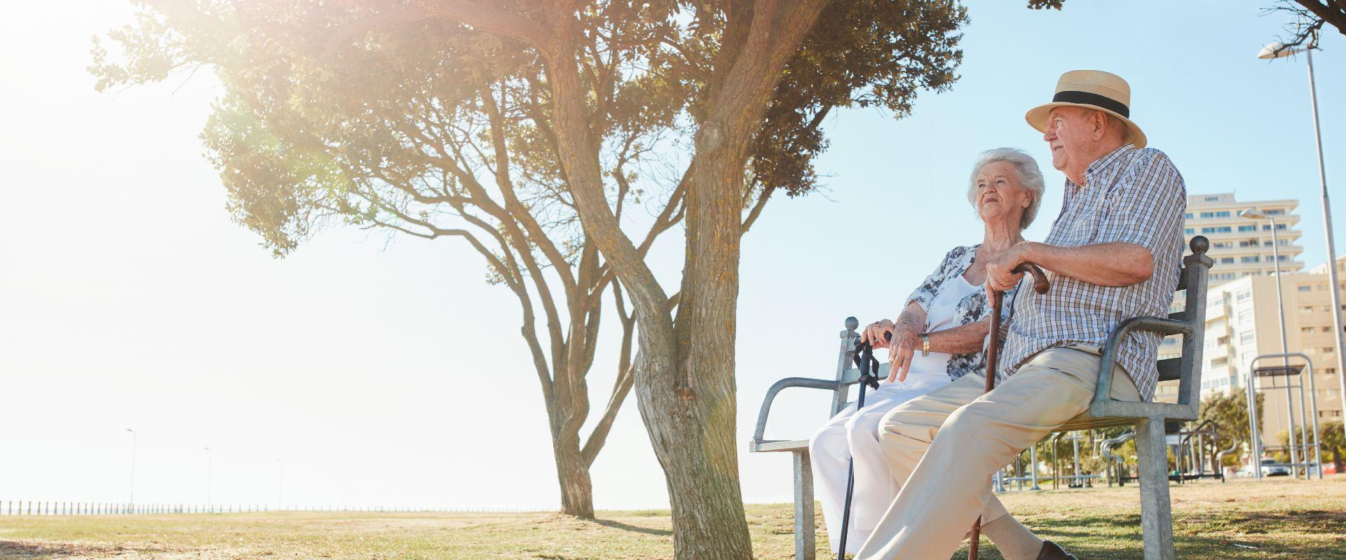 Couple sitting on bench outside