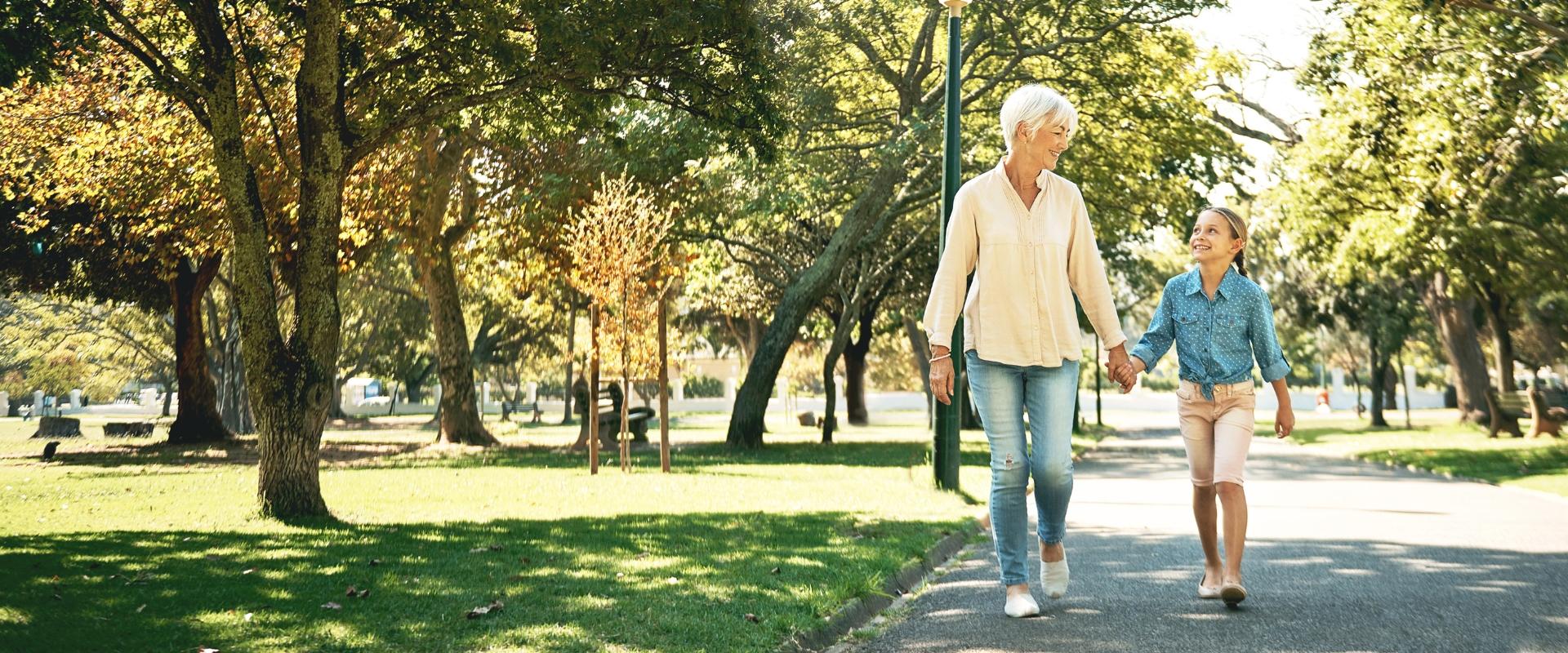 Grandmother walking with grandchild outside
