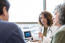 Doctor going over brain scan with patients