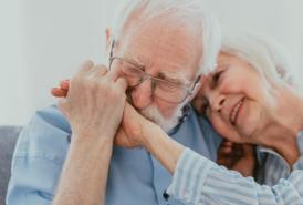 Man kissing his wife's hand
