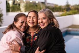 Three women hugging