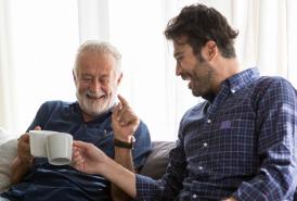 Father and son drinking coffee