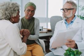 Mother and daughter meeting with doctor