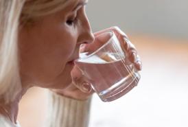 Woman drinking water from a glass