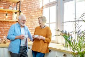 Couple laughing in the kitchen