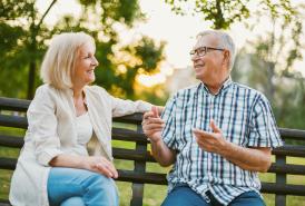 couple talking on a bench