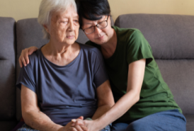 grandchild hugging grandparent