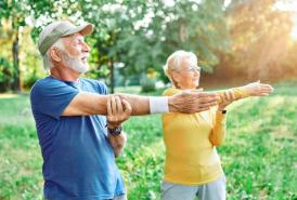 Seniors stretching outdoors
