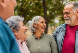 Group of senior friends laughing together outside