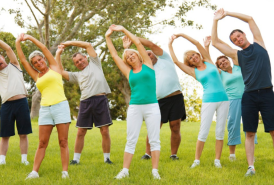 Group of people stretching outside