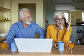 Couple using a laptop