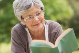 Woman reading a book outside