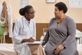 Doctor speaking with patient