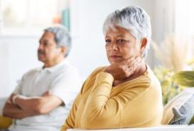 Woman thinking next to husband