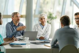 Group of doctors and leaders talking on a meeting 