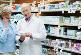 Couple buying medication in a store