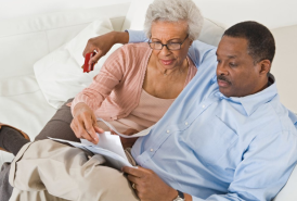 Couple reading together in bed