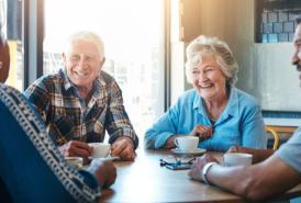 Senior friends talking over coffee