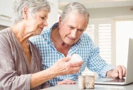 Couple reading pill medications