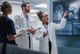 Neurologists looking at brain scans