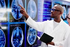 Researcher looking at brain scan
