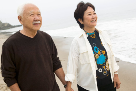 A couple walking on the beach