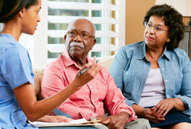 couple talking to medical professional