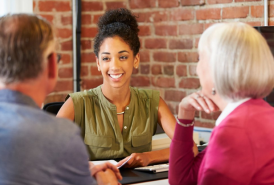 Couple talking to a woman professional