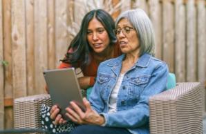 Mother and daughter looking at tablet