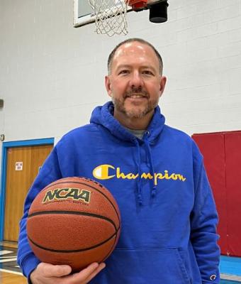 Bill McCleery holding basketball