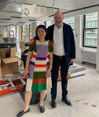 Derek and Bonnie Bandeen posing in warehouse