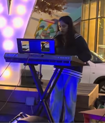 Anika Ganu performing on a keyboard