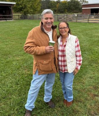 Bob and Deb standing together outside