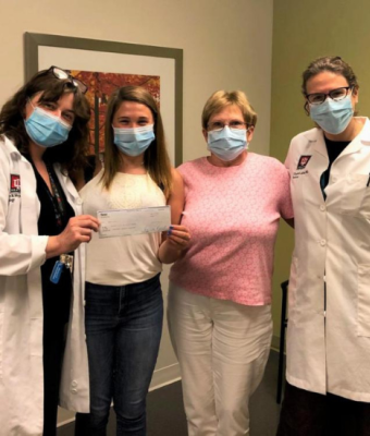 Hannah Wolf with group of doctors