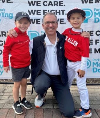 John with family at a Moving Day event