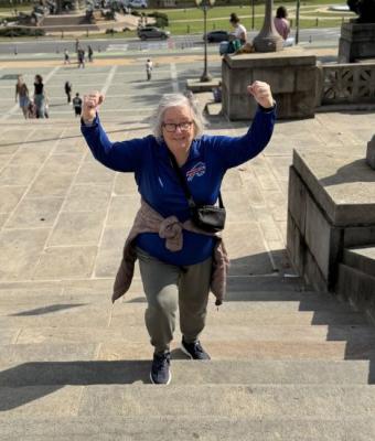 Lynn Scott climbing stairs