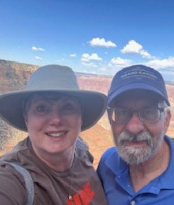 Nancy and her husband outside