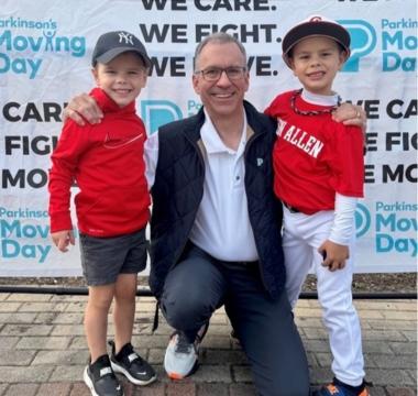 John with family at a Moving Day event