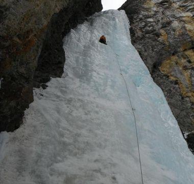Anthony climbs a wall of ice